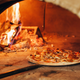 pizza cooking in oven